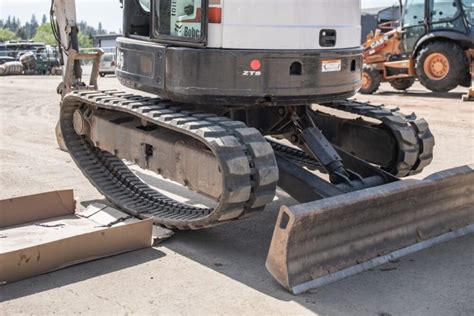 how to put track back on bobcat mini excavator|mini excavator operation youtube.